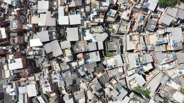 Aerial drone view of Favela Of Cantagalo, Rocinha favelas spread out on the mountain in Sao Conrado , Rio de Janeiro, Brazil.