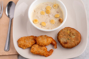 clam chowder  with  bread shrimp and crab cakes