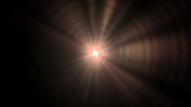 Lens flare light burst animation. Cinematic sun rays with glowing halo and optical flare effect on dark background