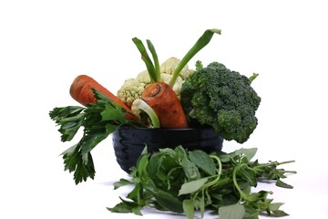 Fresh Mixed Vegetables Bowl With Broccoli, Cauliflower, Carrots And Leafy Greens On White Background