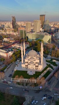 Vertical footage of an aerial drone view of buildings downtown Tirana, Albania
