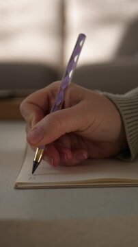 woman writing in empty notebook, cozy morning journaling routine, slow living and mindfulness aesthetic, close-up