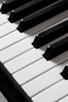 Monochrome piano keys orchestrate a symphony of nostalgia and surreal harmony, invoking World Piano Day and Jazz Appreciation Month