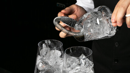 Bartender's hands summon crystalline ice symphony, cocktail alchemy ritual, winter solstice celebration, frosty enchantment for nocturnal revels