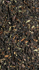Fototapeta premium Aromatic black tea leaves dance in earthy harmony, invoking Samhain rituals and grounding Tibetan meditation ceremonies, richly textured