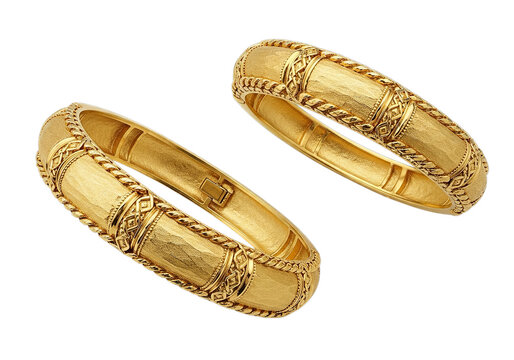 A pair of gold bangles with intricate designs isolated on transparent background