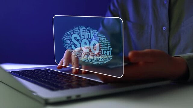 Working on SEO strategies with keywords on a laptop during a late evening session at home.