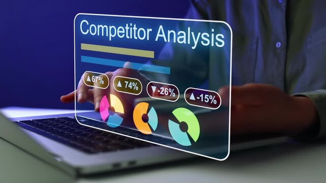 Competitor analysis being conducted on a laptop with digital graphs and statistics displayed in a dark office.