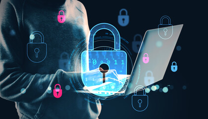 Digital cyber security padlock symbols surrounding person using laptop on dark abstract background...