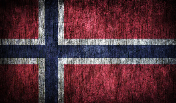 Abstract retro Norway flag on wooden background.