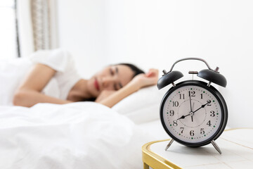 A young woman sleeping in the bed