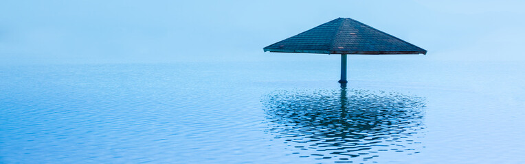 A parasol on the water at the Leonardo Club's private beach. The beautiful Dead Sea © vvvita