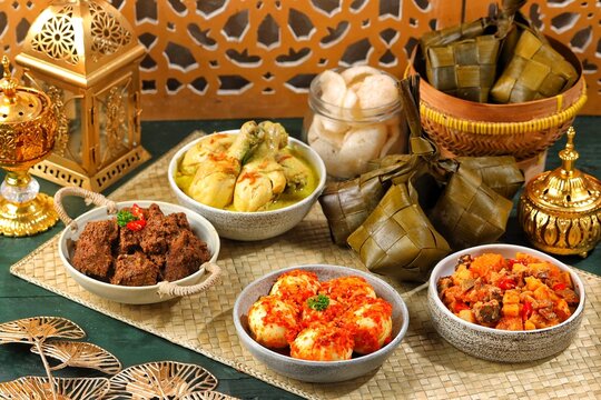 Ketupat Lebaran atau Eid Ketupat. The dishes served during Eid al-Fitr and Eid al-Adha are Ketupat, Opor Ayam, Rendang, Telur Balado, Sayur Labu Siam. Selective Focus .