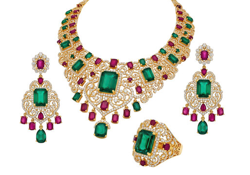 Luxurious gold jewelry set with emeralds and rubies isolated on transparent background
