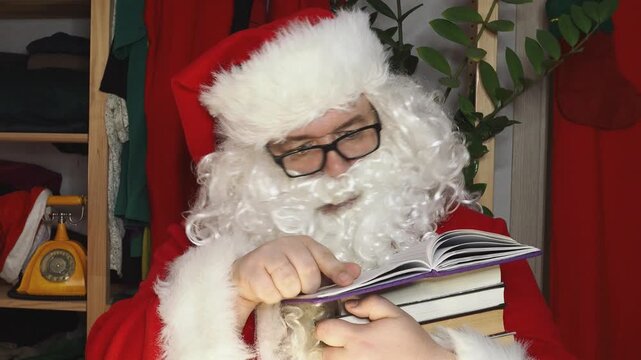 Santa Claus looking at long list with children desire