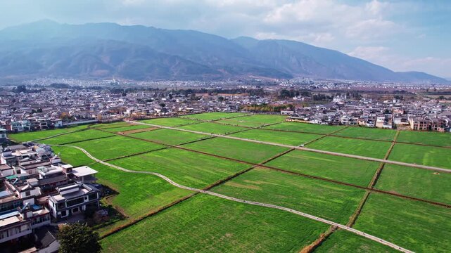 Yunnan Valley Agricultural Landscape with Urban Expansion and Mountains