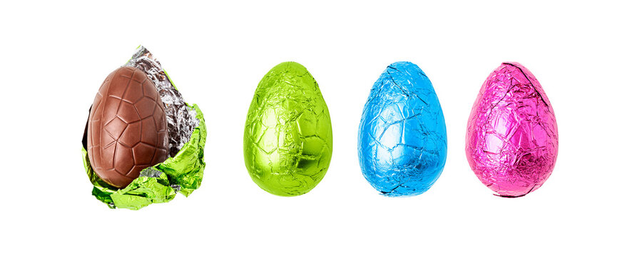 Chocolate easter eggs wrapped in colorful foil, one unwrapped collection banner. Flat lay photography isolated PNG without shadow