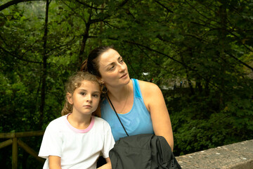 Fototapeta premium Mother and daughter enjoying nature outdoors together