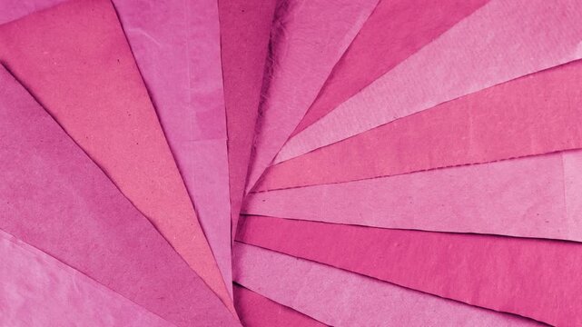 Rotating sheets of handmade paper in various shades of pink, blush, berry and magenta. This eco-friendly craft texture features natural vegetable dyes and recycled materials.