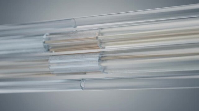 Medium shot showcasing sidebyside bicomponent fibers with two distinct polymer segments aligned lengthwise emphasizing their synergistic material properties for innovative fabric