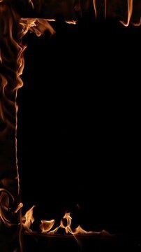 Real flames igniting and spreading to form a rectangular frame against a solid black background, creating an intense border effect perfect for dynamic compositions and fiery overlays