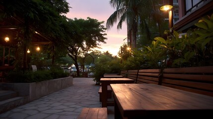 Obraz premium An inviting outdoor seating area with warm ambient lights at twilight surrounded by lush greenery