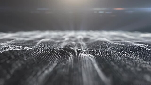 An abstract digital landscape composed of white particles undulates