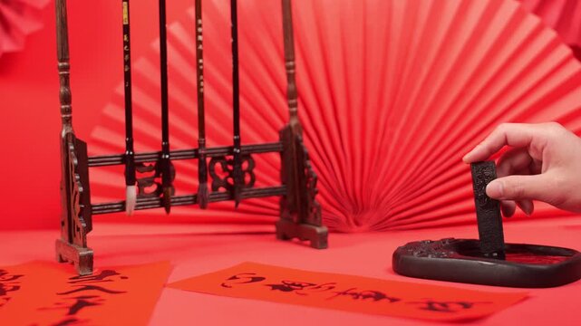 Chinese Calligraphy Festival Setup with Traditional Brushes and Red Lanterns