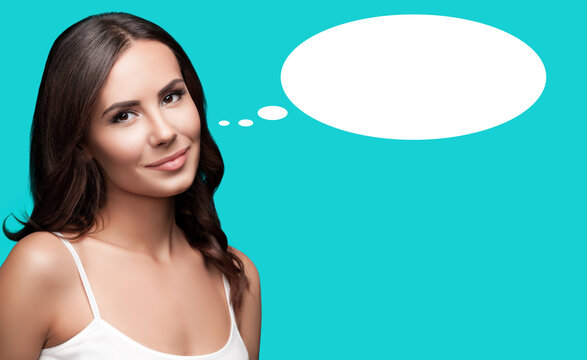 Portrait - thoughtful gazing, gently smile cute young woman, brunette girl, isolated green background. White empty free ad text space mockup speech think bubble, thought float