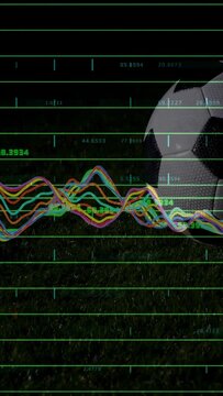 Vertical video: Soccer ball resting on turf, sports data driving waveform over ball showing metrics