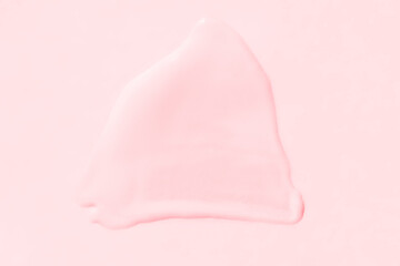 Soft pink creamy texture on light background for skincare and beauty concepts.