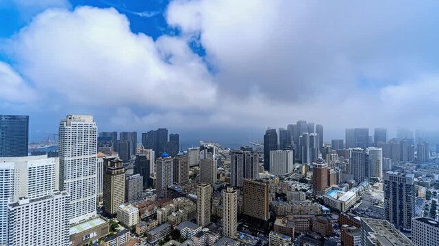 Urban Skyline with Moving Clouds and Blue Sky
