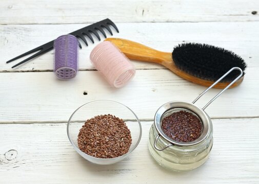 Making natural hair setting lotion for perfect hair. Boiled flax seed filtered into a jar. Organic and healthy stylish hair lotion.