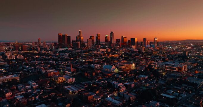 Footage over the uptown Los Angeles, California, USA. View on the high-rise downtown at dusk time.