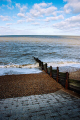Fototapeta premium Waves crashing on the groynes