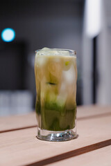 Refreshment in a Glass: Iced Green Drink with Creamy White Layer