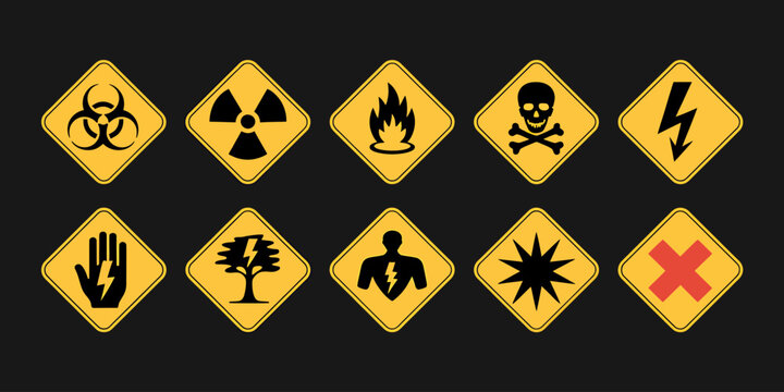Yellow warning signs with various hazard symbols on dark background