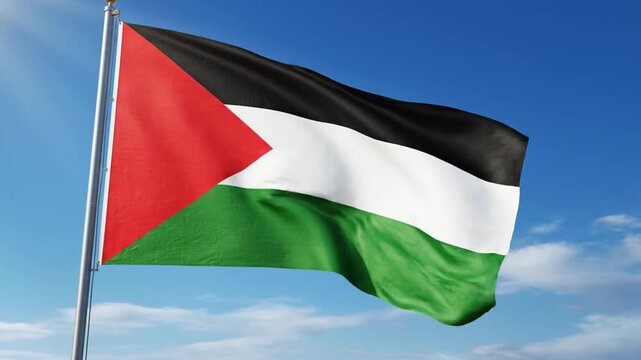 Palestine flag waving proudly against clear blue sky