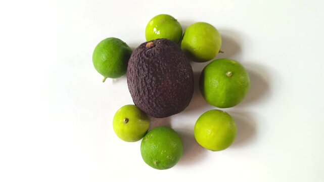 Avocado and limes from Guatemala isolated on white background