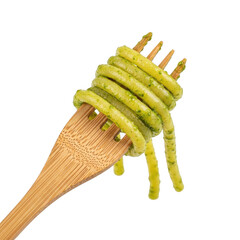 Fork with green spiral pasta, isolated on transparent background