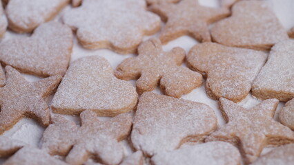 Sweet holiday treats, Assorted homemade cookies with cinnamon aroma and rustic charm, Warm and cozy kitchen scene featuring crumbly cookies decorated for winter holidays