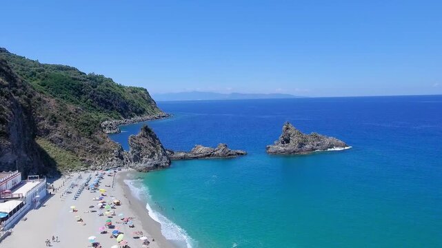 Ulivarella Beach and Ulivo Rock aerial view in slow motion, Calabria, Italy