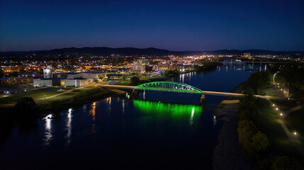 Fototapeta premium Illuminated Bridge Over Nighttime Cityscape