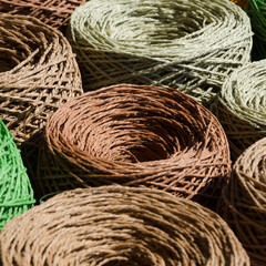 A close-up view of skeins of colorful raffia.