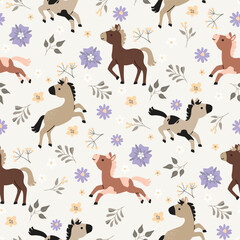 Obraz premium Little horses seamless pattern with blossoms and twigs. Cartoon cute animals having fun in flowering meadow. Brown, gray, yellow, lilac colors. Childish print on fabric and paper. Vector illustration.