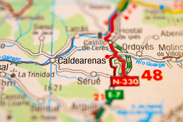 Macro detail of Caldearenas and N330 road in Aragon Spain on printed travel map.