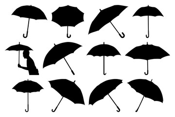 Obraz premium Elegant black umbrella silhouette against a muted blue background, perfect for wedding farewells, travel brochures, and atmospheric graphic design