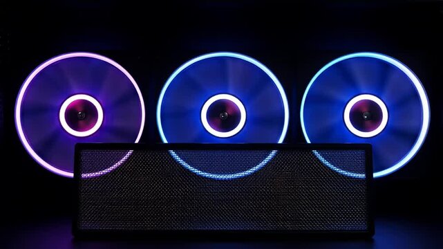 A striking composition of computer cooling fans with vibrant RGB lighting and mesh filter