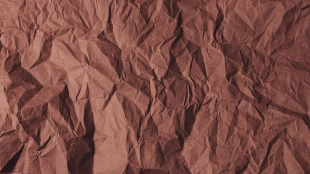 Crafted sheets of eco-friendly paper in dusty rose and muted mauve tones are layered one by one. This textured background showcases a vintage grunge aesthetic with a natural vegetable dye finish.