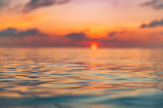 Radiant tranquil sunset ocean closeup with colorful reflections calm water surface serene relaxing seascape nature background. Serene waves ripples peaceful sunlight